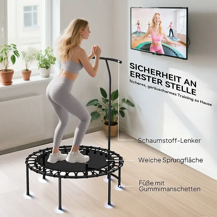 Sportnow Rebounder - Stahl, Schwarz - Schwarzes Minitrampolin mit Haltegriff, Schaumstoffgriff, weicher Sprungfläche und Gummifüßen. Eine Frau trainiert darauf für Heimfitness.