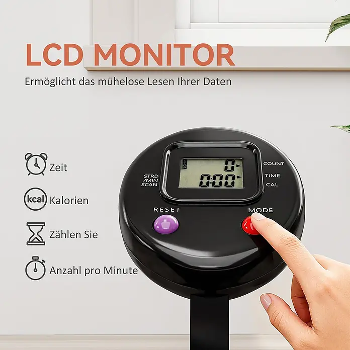 Sportnow Rebounder - Stahl, Schwarz - Schwarzer LCD-Monitor für ein Trainingsgerät, zeigt Trainingsdaten an, eine Hand drückt eine Taste.
