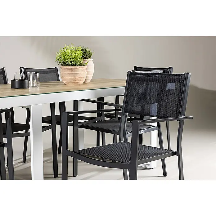 Ebuy24 Gartentisch-Set Merlo - Gesamtumfang: 7 -tlg., L x B x H: 90 x 200 x 75 cm, Ø x H: 90 x 75 cm, Aluminium Textil, Stapelbar - Gartensitzgruppe mit hellem Holztisch, Glasplatte und schwarzen Netzstühlen mit Metallrahmen.