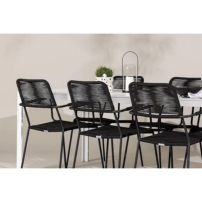 Ebuy24 Gartentisch-Set Break - Gesamtumfang: 7 -tlg., L x B x H: 205 x 90 x 75 cm, Ø x H: 90 x 75 cm, Aintwood Aluminium Polyesterseil Stahl, Stapelbar - Vier schwarze geflochtene Esszimmerstühle mit Metallrahmen an einem weißen Tisch.