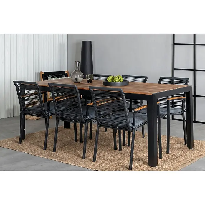 Ebuy24 Gartentisch-Set Bois - Gesamtumfang: 7 -tlg., L x B x H: 205 x 90 x 76 cm, Ø x H: 90 x 76 cm, 100 % Polyester, Holz, Rattan, Stahl Akazie, Aluminium, Stapelbar - Garten-Essgruppe: Tisch aus schwarzem Metall und Holz mit sechs Stühlen aus schwarzem Seilgeflecht, grauen Kissen und Holzarmlehnen.