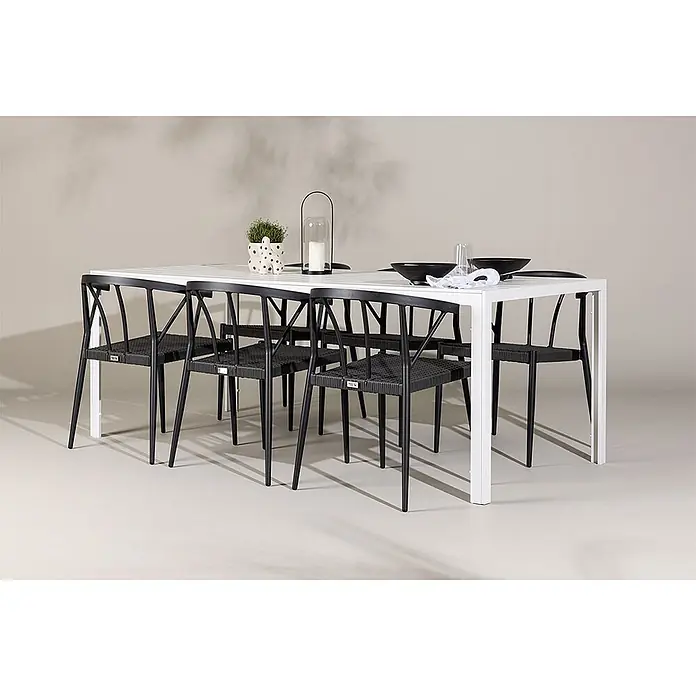 Ebuy24 Gartentisch-Set Break - Gesamtumfang: 7 -tlg., L x B x H: 205 x 90 x 75 cm, Ø x H: 90 x 75 cm, Aintwood Aluminium Korbmöbel, Stapelbar - Weißer rechteckiger Esstisch mit sechs schwarzen Stühlen mit geflochtenen Sitzen, geeignet für den Außenbereich.