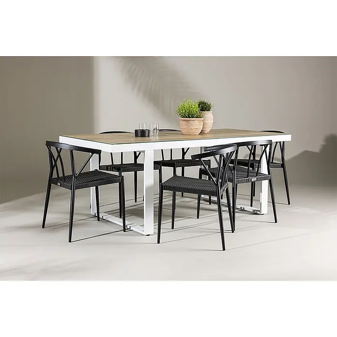 Ebuy24 Gartentisch-Set MerloStina - Gesamtumfang: 7 -tlg., L x B x H: 90 x 200 x 75 cm, Ø x H: 90 x 75 cm, Aluminium, Stapelbar - Esstischgruppe für draußen mit rechteckigem Tisch, weißem Gestell, Tischplatte in Holzoptik und schwarzen geflochtenen Stühlen.