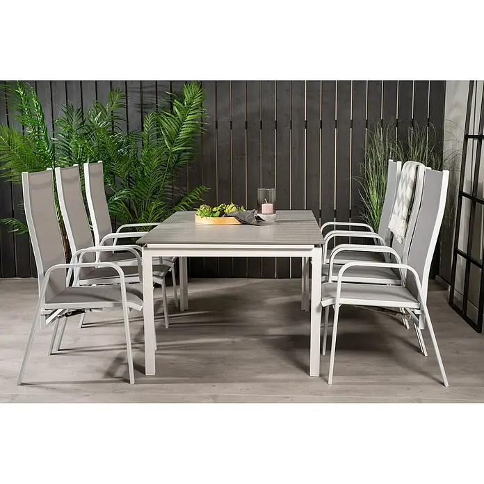 Ebuy24 Gartentisch-Set Levels - Gesamtumfang: 7 -tlg., L x B x H: 100 x 160 x 75 cm, Ø x H: 100 x 75 cm, 30 % Polyester, 70 % PVC, Aluminium, Textil Aintwood, Aluminium, Stapelbar - Gartenessgruppe mit grauem Tisch und sechs Stühlen mit weißem Gestell und grauem Stoffbezug.