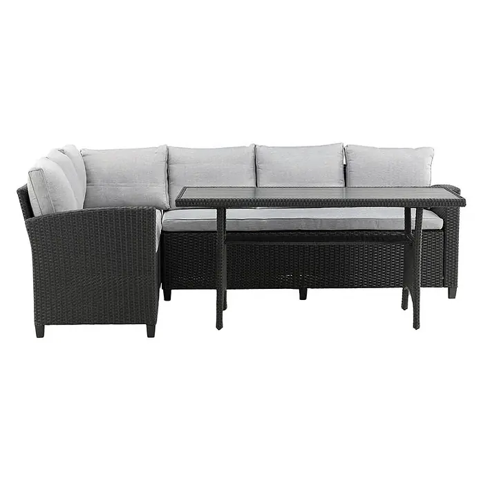 Ebuy24 Loungemöbel-Set Brentwood - 2 -tlg., Holz Korbmöbel Polyester, Schwarz - Dunkelgraue Outdoor-Lounge-Sitzgruppe mit L-förmigem Sofa und rechteckigem Tisch, beide mit hellgrauen Kissen und Geflechtstruktur.