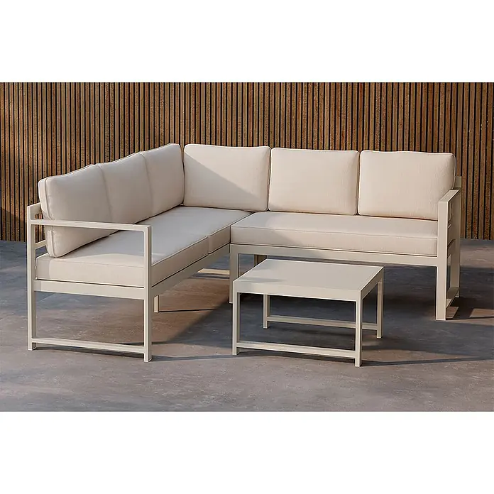 Ebuy24 Loungemöbel-Set Salvador - 2 -tlg., Aluminium, Beige - Helles beiges Metall-Ecksofa für draußen mit dicken Polstern und passendem quadratischem Couchtisch auf einer Terrasse.