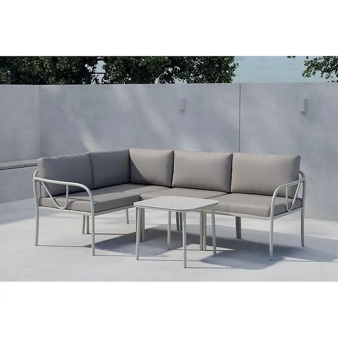 Ebuy24 Loungemöbel-Set Hydra - 2 -tlg., Stahl, Grau - Hellgraues Outdoor-Ecksofa mit grauen Kissen und passendem quadratischem Couchtisch auf einer Terrasse.