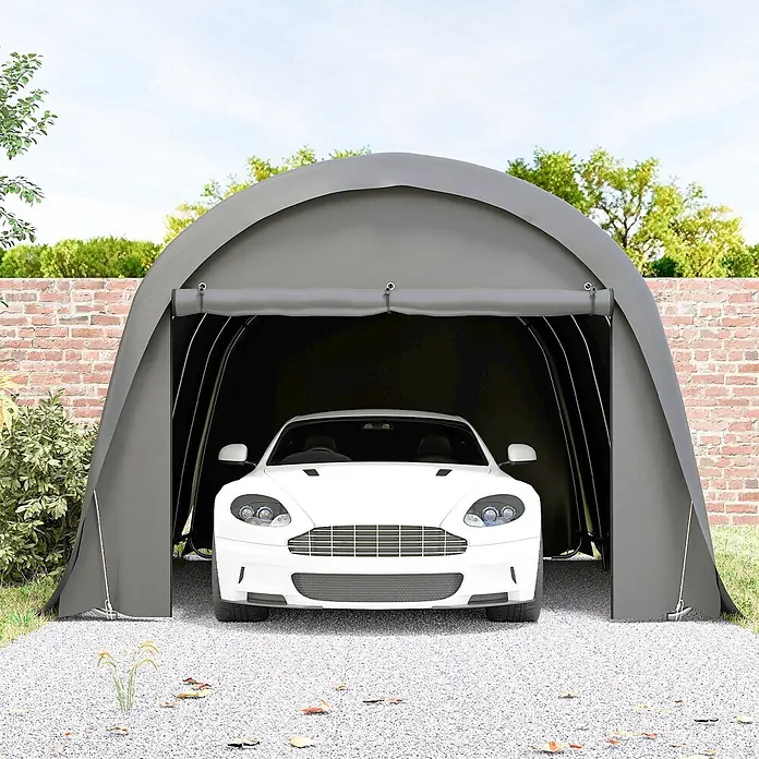 Outsunny Carport - Außenmaß inkl. Dachüberstand (B x T): 3 x 6 m, Dunkelgrau - Graues tragbares Autozelt schützt einen weißen Sportwagen auf einer Kiesauffahrt.