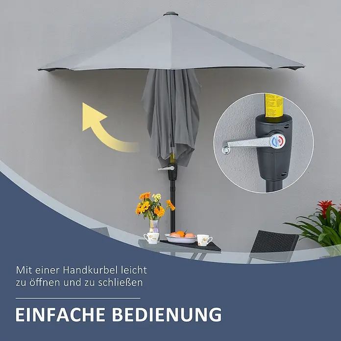 Outsunny Marktschirm - Dunkelgrau - Teilweise geöffneter grauer Kurbelschirm mit Nahaufnahme des leicht bedienbaren Kurbelmechanismus, neben einem Terrassentisch.