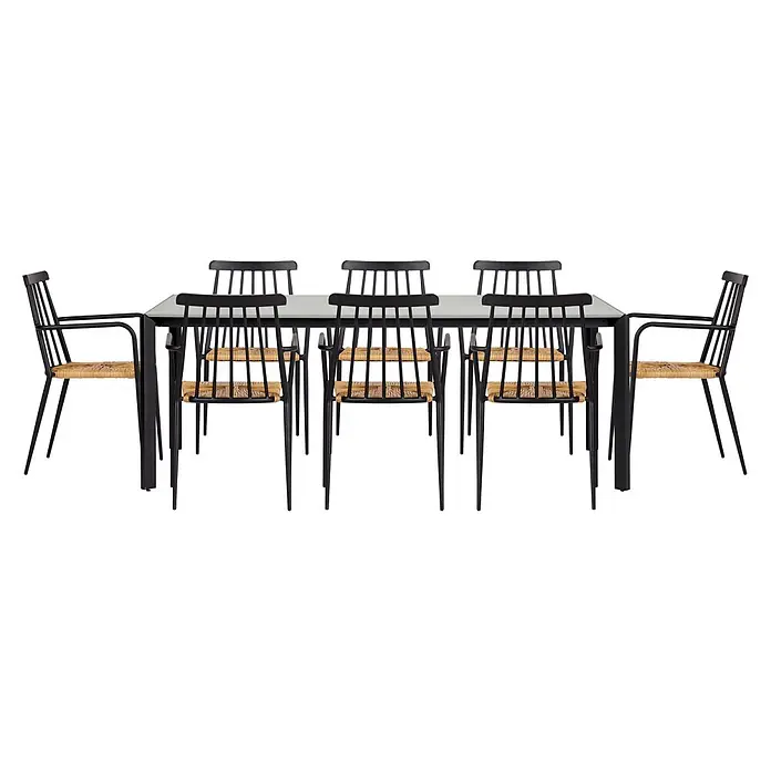 Ebuy24 Gartenstuhl Evira - Aluminium, Rattan Rattan = Polyrattan, Schwarz, B x T x H: 58 x 54 x 84 cm - Ein schwarzer Esstisch mit hellgrauer Platte, umgeben von schwarzen Stühlen mit geflochtenen Strohsitzen. Einige Stühle haben Armlehnen.