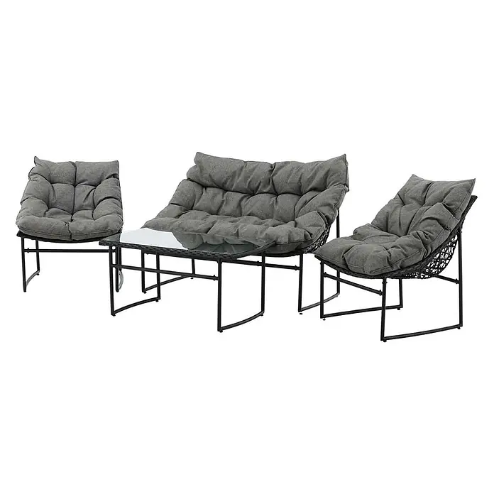 Ebuy24 Loungemöbel-Set Tina - 4 -tlg., Stahl, Schwarz - Garten-Lounge-Set: zwei schwarze Rattansessel, ein Zweisitzer-Sofa und ein Couchtisch mit Glasplatte, alle mit grauen Kissen.