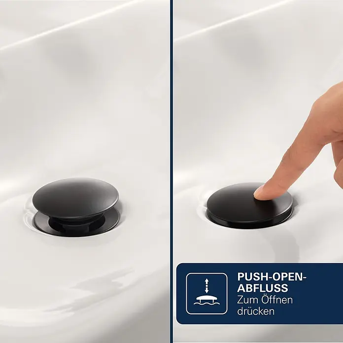 Grohe Dice Waschtischarmatur M-Size - Höhe: 172 mm, Schwarz, Matt - Schwarzer Push-Open-Ablaufstopfen im weißen Waschbecken, geschlossen und beim Drücken zum Öffnen.