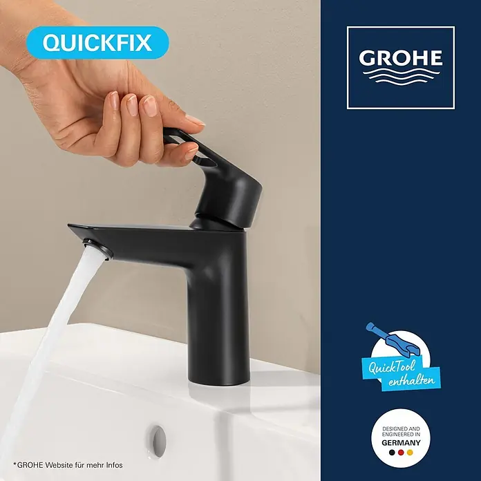 Grohe Start Loop Waschtischarmatur M-Size - Höhe: 164 mm, Schwarz, Matt - Mattschwarze Grohe Armatur mit Wasserstrahl in ein weißes Waschbecken, von einer Hand bedient.