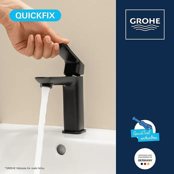 Grohe Dice Waschtischarmatur M-Size - Höhe: 172 mm, Schwarz, Matt - Schwarzer Grohe Wasserhahn mit fließendem Wasser in einem weißen Waschbecken, von einer Hand bedient.