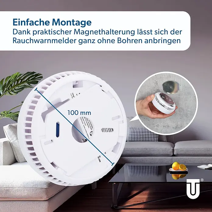 UniTEC Rauchwarnmelder Kriwan/TÜV - Durchmesser: 90 mm, Alarmsignal: 85 dB - Weißer Rauchmelder mit 100 mm Durchmesser, magnetisch an der Wand in einem Wohnzimmer montiert.