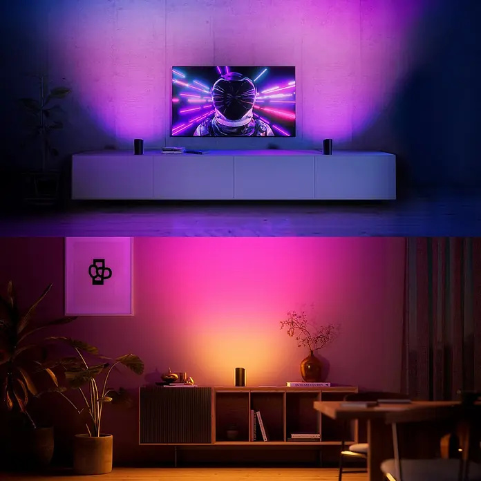 Philips Hue LED-Tischleuchte Play Wallwasher - L x B x H: 9,1 x 7,6 x 15,7 cm, Weiß, RGBW - Dunkle zylindrische smarte Leuchten werfen lebendiges Umgebungslicht an Wände in einem Wohnbereich.