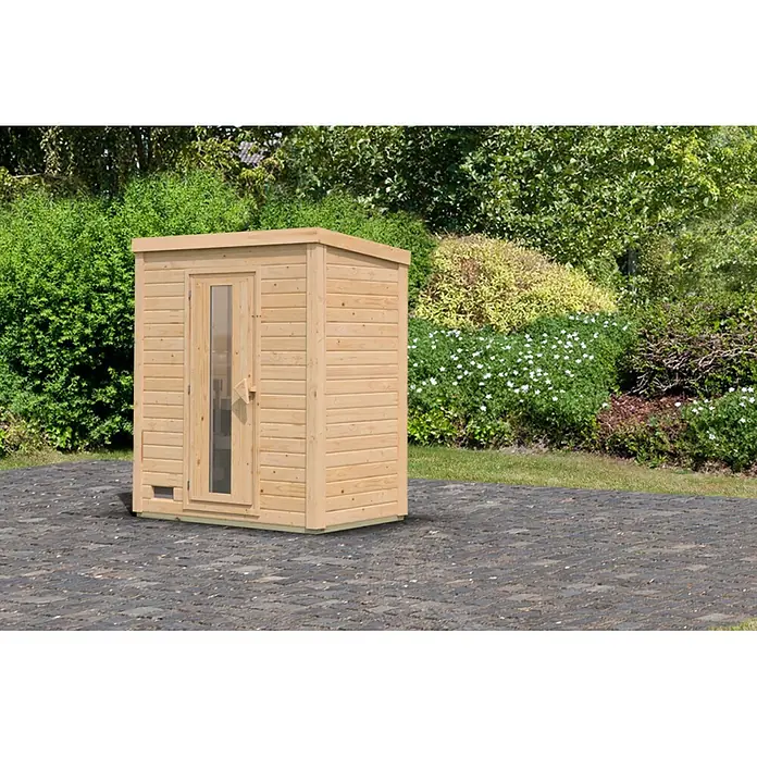Karibu Saunahaus Hytti - Ohne Ofen, Natur, L x B x H: 113 x 196 x 228 cm - Kompakte Außensaunakabine aus hellem Naturholz mit Glastür, auf Pflastersteinen im Garten.