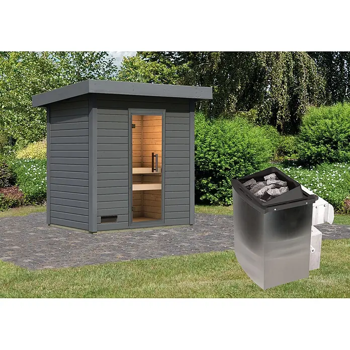 Karibu Saunahaus Kaapi 2 - 9 KW Ofen mit interner Steuerung, Anthrazit, L x B x H: 146 x 196 x 228 cm - Dunkelgraue Außensaunakabine mit Glastür und Edelstahl-Saunaofen mit Steinen.