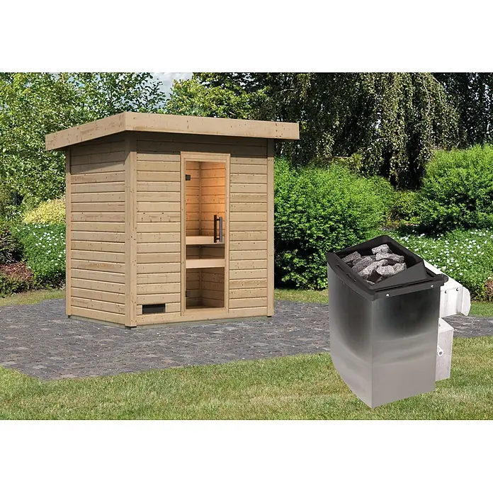 Karibu Saunahaus Kaapi 2 - 9 KW Ofen mit interner Steuerung, Natur, L x B x H: 146 x 196 x 228 cm - Helle Holz-Außensaunakabine mit Glastür und separatem dunklen Saunaofen mit Steinen, auf einer Terrasse im Garten.