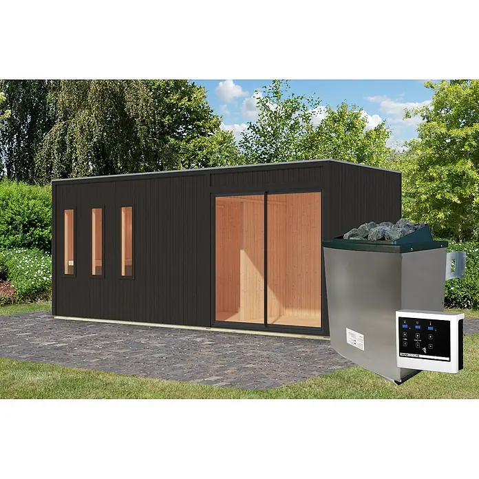 Karibu Saunahaus Monterey - L x B x H: 216,3 x 573,5 x 244,1 cm, Schwarz, 9 KW Ofen mit externer Steuerung - Dunkelgraue Außensaunakabine mit Glastür und Holzinterieur. Daneben ein Edelstahl-Saunaofen mit Steinen und weißem Bedienfeld.