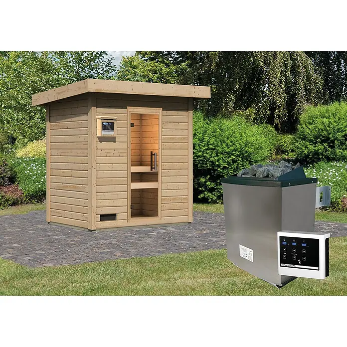 Karibu Saunahaus Kaapi 2 - 9 KW Ofen mit externer Steuerung, Natur, L x B x H: 146 x 196 x 228 cm - Outdoor-Holzsaunakabine auf Pflastersteinen, mit separatem Saunaofen aus Metall und einem digitalen Bedienfeld auf Gras.