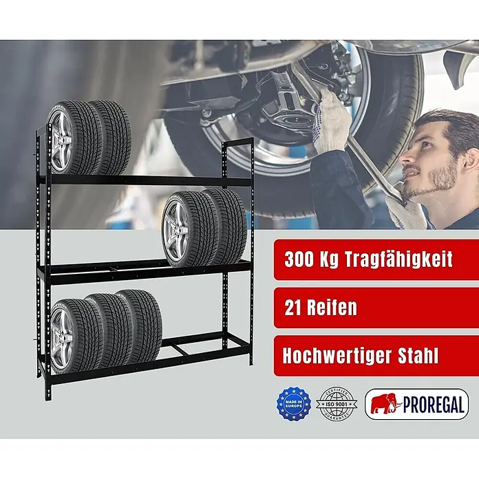 Proregal Reifenregal Tiger XL - Stecken, Schwarz - Schwarzes Metall-Reifenregal mit mehreren Reifen, in einer Werkstattumgebung.