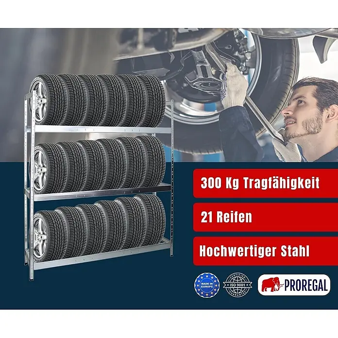 Proregal Reifenregal Tiger XL - Stecken, Verzinkt - Silbernes Stahl-Reifenregal mit drei Ebenen, bestückt mit 21 Autoreifen, in einer Werkstattumgebung.