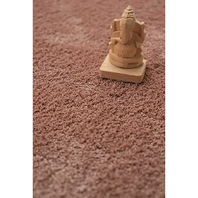 Bricoflor Teppichfliese - Breite: 50 cm, Velours, pink - Kleine geschnitzte Holzstatue von Ganesha auf einem weichen, rotbraunen Hochflorteppich.