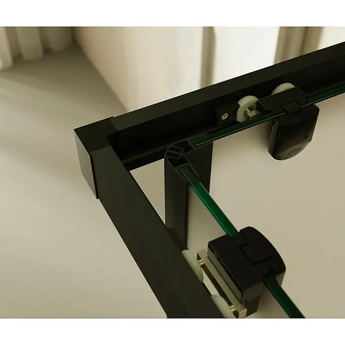 i-flair Eckdusche DK79FR80x90 - Beschichtet, Schwarz, Stärke: 6 mm - Schwarzer Aluminiumrahmen mit grünem Glas und weißen Rollen für eine Schiebetürduschkabine, zeigt den oberen Eckmechanismus.