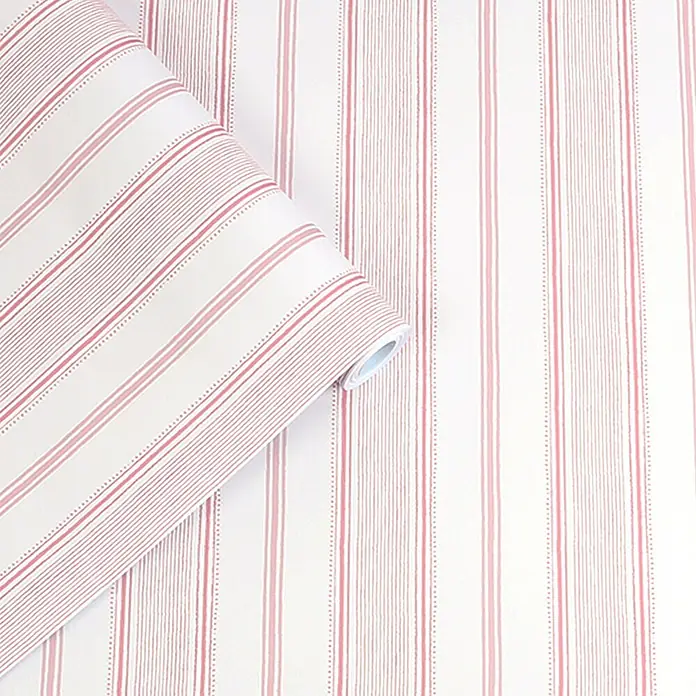 Laura Ashley Vliestapete Vliestapete Heacham - Rosa, Ornament, 10 x 0,52 m - Weiße Tapete mit roten und rosa vertikalen Streifen, teils durchgezogen, teils gepunktet, teilweise ausgerollt.
