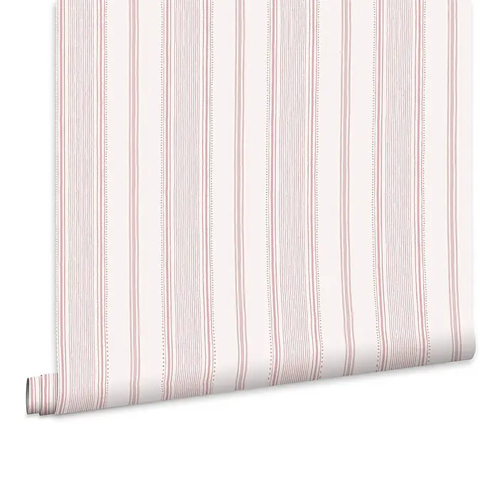 Laura Ashley Vliestapete Vliestapete Heacham - Rosa, Ornament, 10 x 0,52 m - Rosa-weiß gestreifte Tapete, die sich von einer Rolle abwickelt.