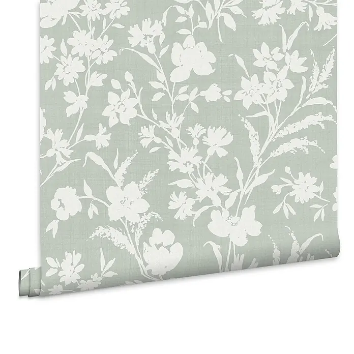Laura Ashley Vliestapete Rye Blumen Monoprint - Grün, Floral, 1.000 x 52 cm - Hellgrüne Tapete mit weißem Blumenmuster, teilweise abgerollt.