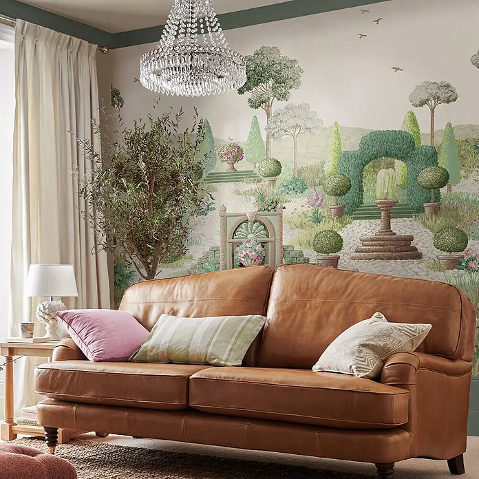 Fototapete Naunton Folly Landschaft -  - Gemütliches braunes Ledersofa mit Zierkissen in einem Wohnzimmer.