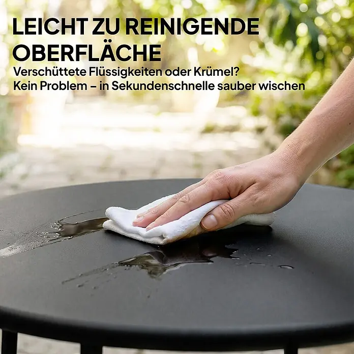 Outsunny Balkontisch rund - Ø x H: 50 x 45,5 cm, Metall, Schwarz - Hand wischt eine schwarze, leicht zu reinigende Tischoberfläche mit einem weißen Tuch sauber.