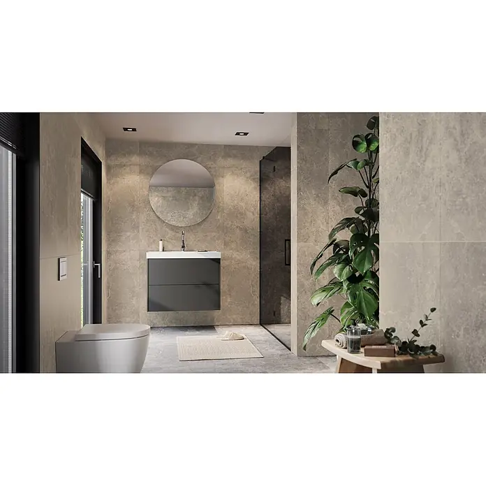 Germania Waschtischunterschrank GW-BODERA - B x T x H: 81 x 46 x 65 cm, Graphit - Modernes Badezimmerinterieur mit einem dunkelgrauen schwebenden Waschtisch, einer weißen Wandtoilette und einem runden Spiegel vor strukturierten grauen Fliesen.