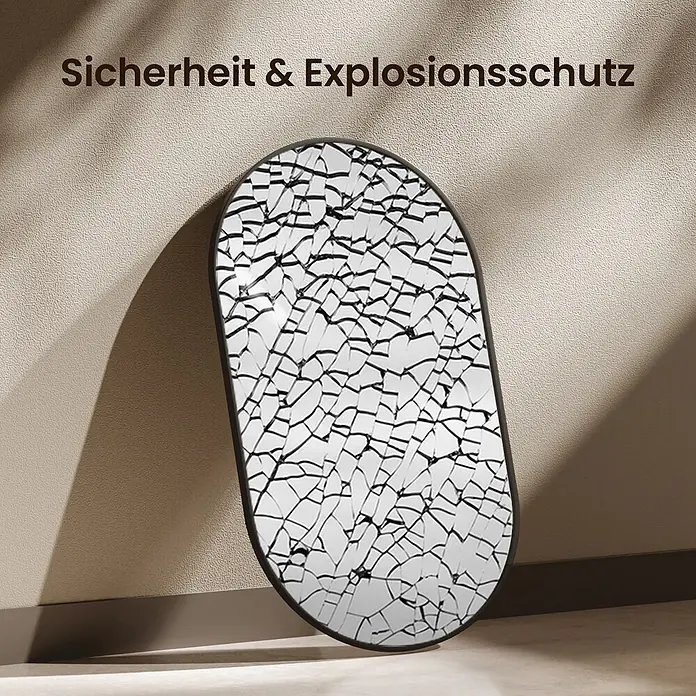 Emke Rahmenspiegel OM18 - Glas - Ovaler Sicherheitsspiegel mit zersprungener Oberfläche, demonstriert Bruchschutz.