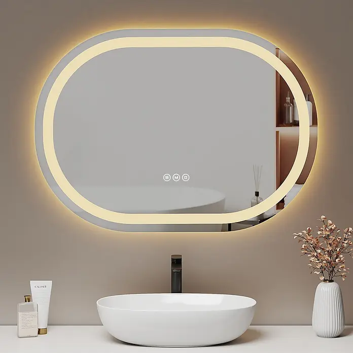 Emke Lichtspiegel Dimlite OLM06 - 80 x 60 cm - Ovaler LED-beleuchteter Badezimmerspiegel mit Antibeschlag und Touch-Bedienelementen über einem weißen Waschbecken.