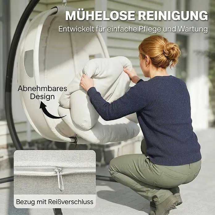 Outsunny Hängesessel - Stahl, Hellgrau, Schwarz - Eine Frau legt ein helles Kissen in einen Hängesessel. Der Bezug ist abnehmbar und hat einen Reißverschluss zur einfachen Reinigung.
