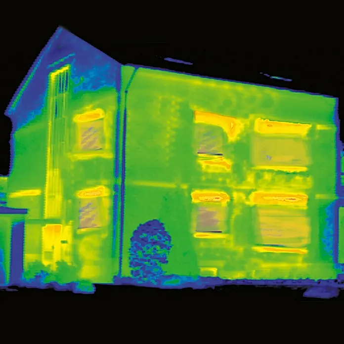 Solid Elements Rollladenkasten-Dämmmatte RKD 25 - 1.000 x 500 x 25 mm - Wärmebildaufnahme eines Hauses, die Wärmeverluste an Fenstern und Dach zeigt. Es visualisiert Energieeffizienz und Isolationsmängel deutlich.