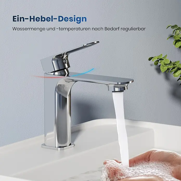 Emke Waschtischarmatur Slimtrim XF23 - Chrom, Glänzend - Verchromte Einhebel-Armatur auf einem Waschbecken mit fließendem Wasser, das die regulierbare Menge und Temperatur zeigt.