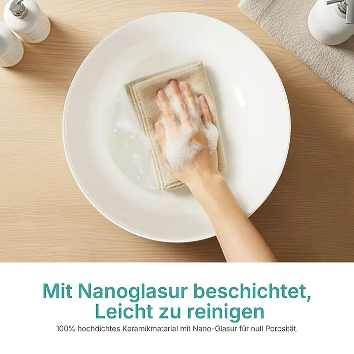 Emke Aufsatzwaschbecken Ceraround CB30 - 41 x 41 cm, Hahnloch: Ohne, Ohne Überlauf, Weiß - Eine Hand reinigt ein weißes Keramikbecken mit Tuch und Seife. Die Nanoglasur-Oberfläche ermöglicht leichte Reinigung.