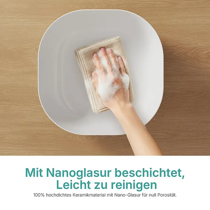 Emke Aufsatzwaschbecken Bovelari CB20 - 41,5 x 41,5 cm, Hahnloch: Ohne, Ohne Überlauf, Weiß - Eine Hand reinigt mit Tuch und Schaum ein weißes Keramikwaschbecken, das seine leicht zu reinigende Nanoglasur zeigt.