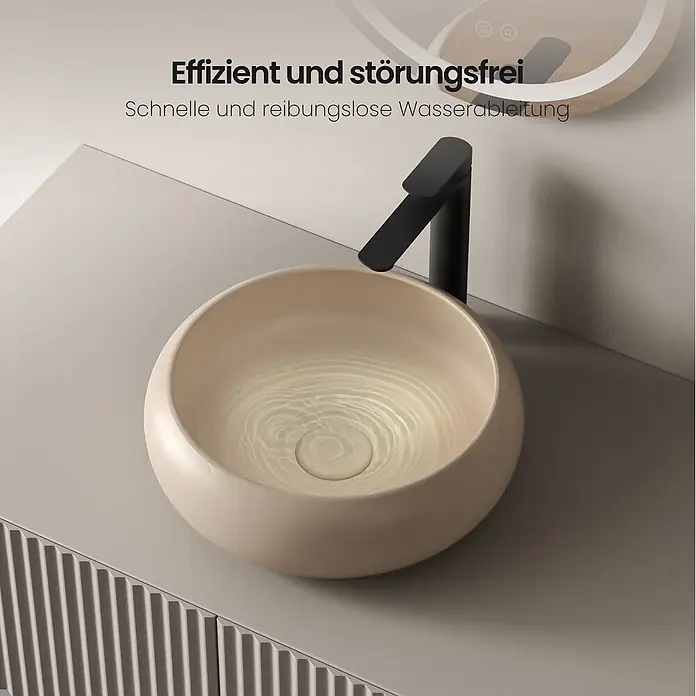 Emke Aufsatzwaschbecken Ceraround CB11 - 36 x 36 cm, Hahnloch: Ohne, Ohne Überlauf, Beige - Rundes beiges Keramikwaschbecken mit schwarzem Wasserhahn und fließendem Wasser für schnelle Entwässerung.