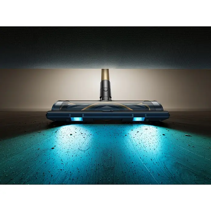 Mova Aspirador de batería S5 Sense - 570 W, Volumen de recipiente: 0,6 l - Cabezal de aspiradora con luces LED azules iluminando suciedad en suelo de madera bajo muebles.