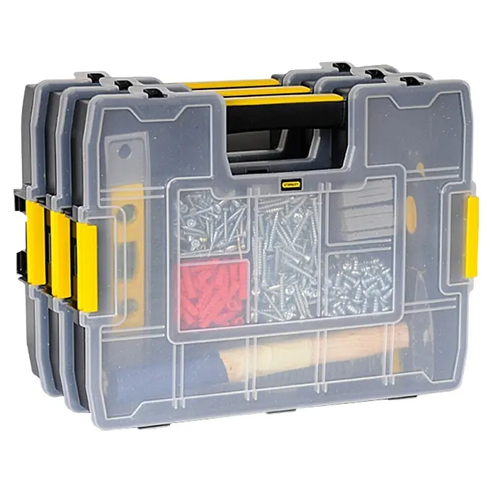 Stanley Estuche para piezas pequeñas Sortmaster Junior - L x An x Al: 29,2 x 37,5 x 6,7 cm - Esta imagen muestra un organizador transparente Stanley lleno de herramientas y sujetadores, con detalles amarillos.