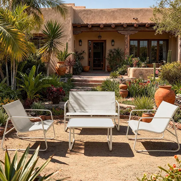 Happy Garden Loungemöbel-Set TENERIFE - 4 -tlg., Stahl, Beige - Ein hellgraues Outdoor-Möbelset mit zwei Stühlen, einer Gartenbank und einem Couchtisch, auf einem Kiespatio vor einem Haus.