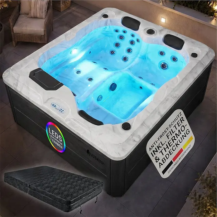 Artsauna Außen-Whirlpool Oasis - 160 x 210 x 80 cm, Grau - Ein beleuchteter Juskys Whirlpool mit blauer LED-Beleuchtung auf einer Terrasse, mit dunklem Holz-Look, weißem Marmorrand und schwarzer Thermoabdeckung.