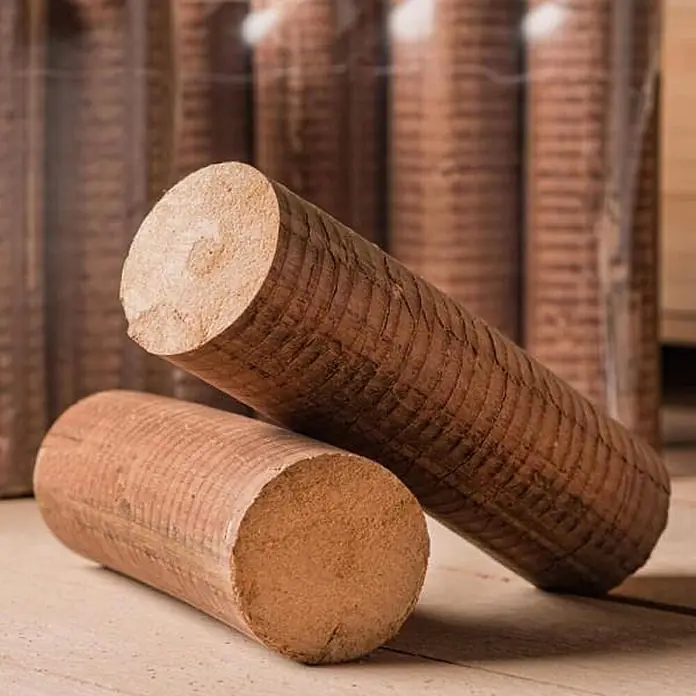 HOLZBRX Holzbriketts POLLMEIER Premium Plus Buchenholzbriketts 960kg Palette - Buche, 960 kg - Zwei braune Holzbriketts auf Holzuntergrund, weitere Briketts im Hintergrund.