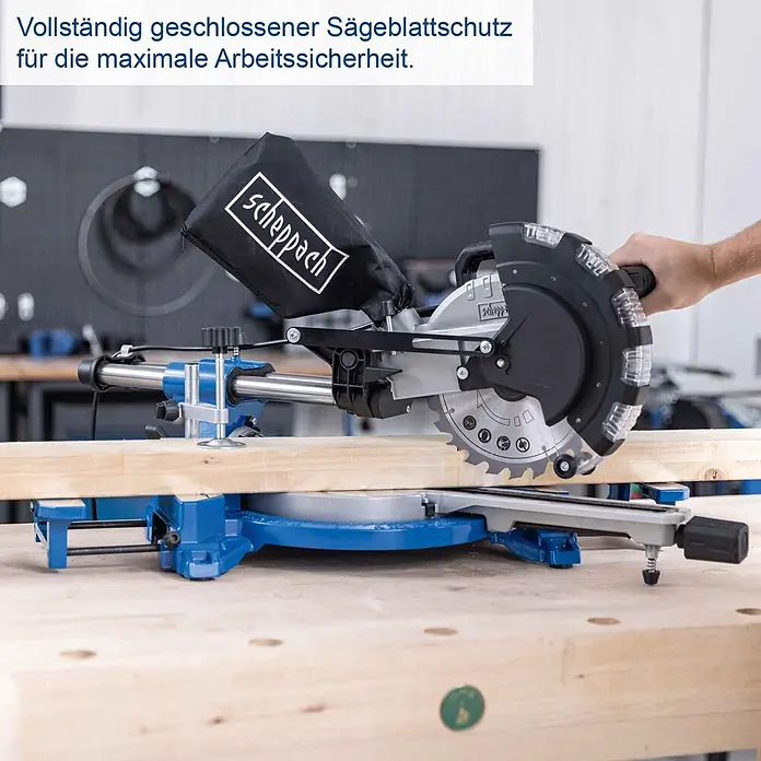 Scheppach Kappzugsäge HM216 - 2.000 W, Durchmesser Sägeblatt: 216 mm, Leerlaufdrehzahl: 4.700 U/min - Blaue Scheppach Kapp- und Gehrungssäge mit geschlossenem Sägeblattschutz und Staubbeutel, sägt ein Holzbrett für hohe Arbeitssicherheit.