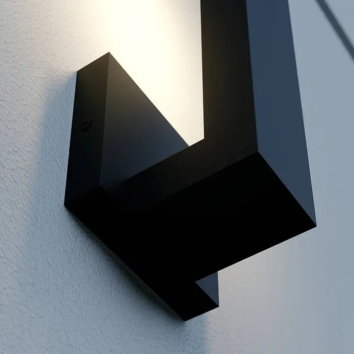 Lindby Außenwandleuchte Isadore - schwarz, schwarz, IP44 - Schwarze, geometrische Wandleuchte an strukturierter Wand, wirft Licht nach oben und unten.